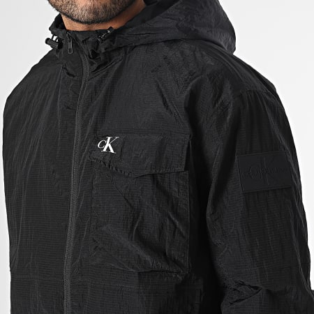 Calvin Klein - Giacca a vento 2499 Ripstop nero con cappuccio e zip