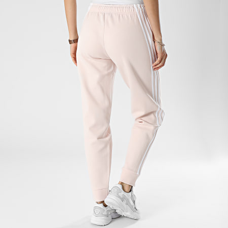 Adidas Sportswear - Pantaloni da jogging a fascia rosa pastello da donna IB8533