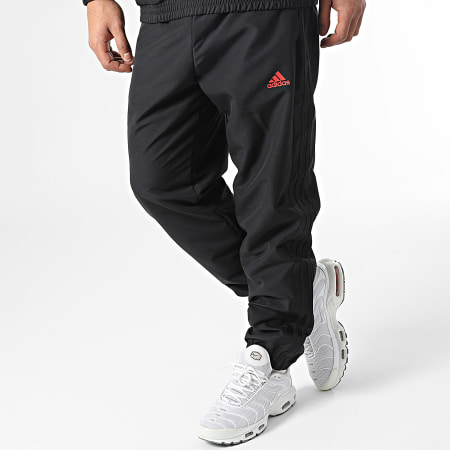 Adidas Sportswear - Tuta da ginnastica a righe nere IC6771