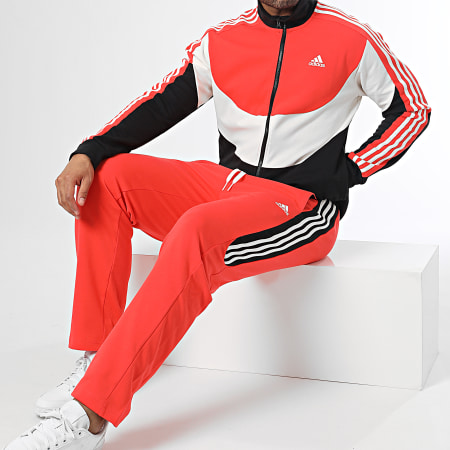 Adidas Sportswear - Tuta da ginnastica a righe colorblock IC6753 Arancione Nero Bianco