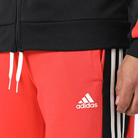 Adidas Sportswear - Tuta da ginnastica a righe colorblock IC6753 Arancione Nero Bianco