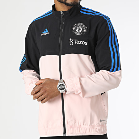 Adidas Performance - Manchester United HT4297 Chaqueta con cremallera a rayas rosa y negra