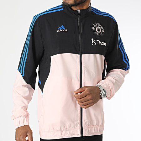 Adidas Performance - Manchester United HT4297 Chaqueta con cremallera a rayas rosa y negra