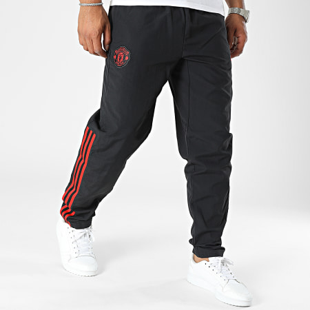 Adidas Sportswear - Manchester United IA7296 Pantaloni da jogging a bande nere