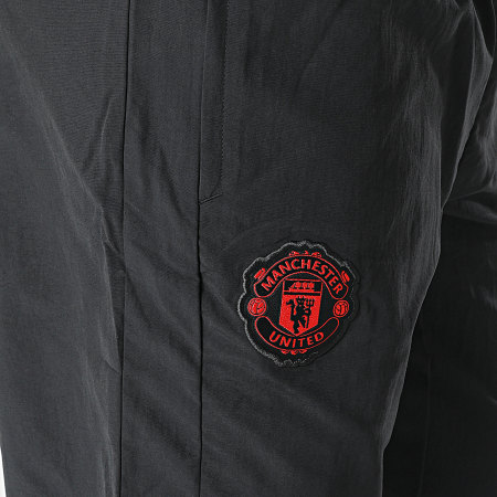 Adidas Performance - Manchester United IA7296 Pantalón de chándal con banda negro