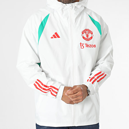 Adidas Sportswear - Giacca a vento con cappuccio del Manchester United IA7297 Bianco