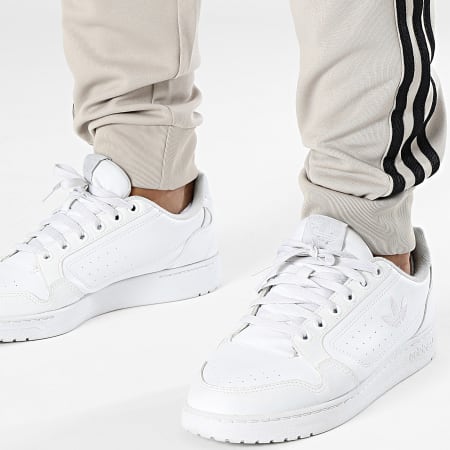 Adidas Originals - Pantaloni da jogging a fascia IM4544 Beige
