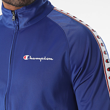 Champion - 219784 Set giacca e pantaloni da jogging con zip blu reale e nera