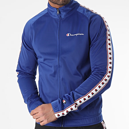 Champion - 219784 Set giacca e pantaloni da jogging con zip blu reale e nera