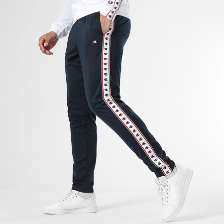Champion - 219784 Set giacca con zip e pantaloni da jogging bianchi e marini