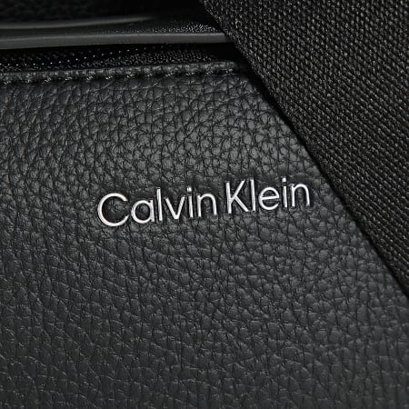 Calvin Klein - Sacoche Must Reporter 1606 Noir