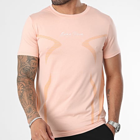 Zelys Paris - Conjunto de camiseta y pantalón corto jogging naranja claro jaspeado negro