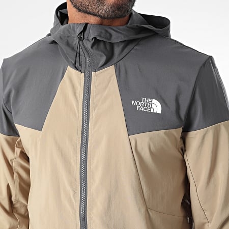 The North Face - Chaqueta Wind Track A87J2 Beige Negra con capucha y cremallera