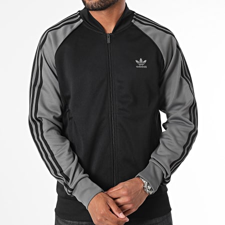 Adidas Originals - IY9858 Chaqueta con cremallera a rayas negra y gris