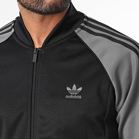 Adidas Originals - IY9858 Chaqueta con cremallera a rayas negra y gris