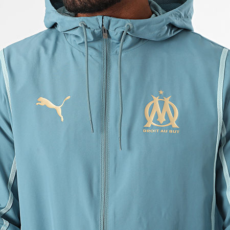 Puma - OM Prematch 778243 Giacca con zip con cappuccio blu chiaro e oro