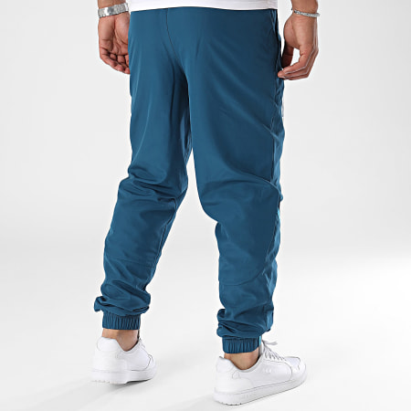 Puma - OM Prematch Woven 778244 Pantalones de chándal azul pato