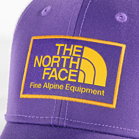 The North Face - Gorra Trucker Mudder Morada Blanca