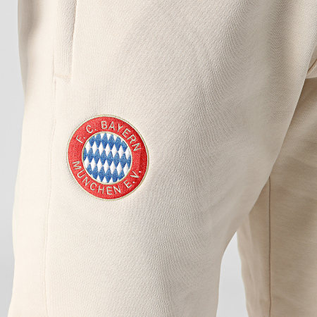 Adidas Originals - Pantaloni da jogging a bande beige del Bayern Monaco IS6510