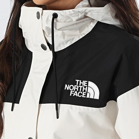 The North Face - Cortaviento largo para mujer Reign On A8BCJ Ecru Black