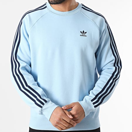 Felpa adidas azzurra con strisce bianche on sale