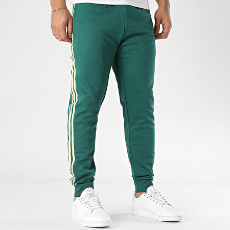 Pantaloni champion verdi strisce bianche store