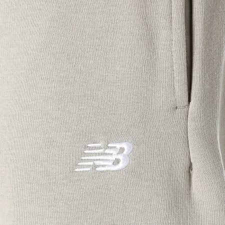 New Balance - Pantalones de chándal de forro polar MP41503 Taupe