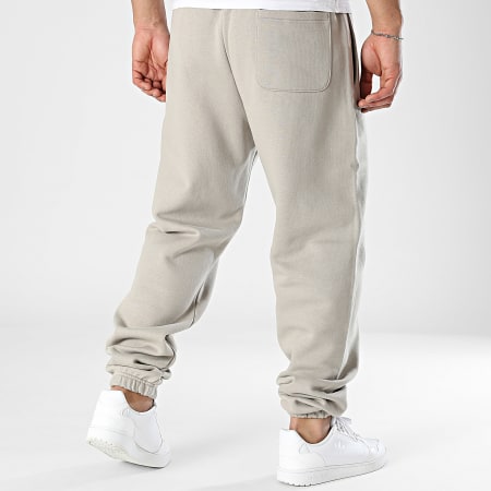 New Balance - Pantalones de chándal de forro polar MP41503 Taupe
