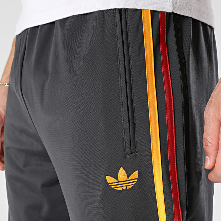 Adidas Originals - Pantalon Jogging A Bandes Firebird TP KD3831 Gris Anthracite Bordeaux Jaune