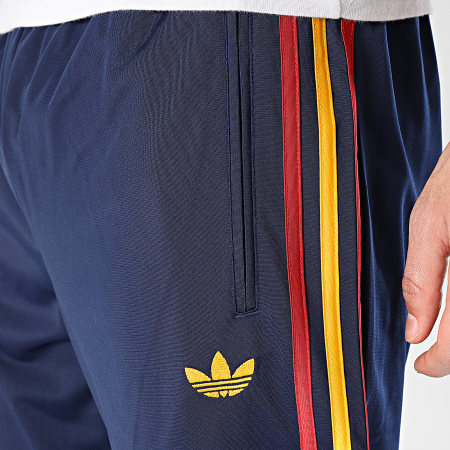Adidas Originals - Pantalon Jogging A Bandes Firebird TP KD3836 Bleu Marine Bordeaux Jaune