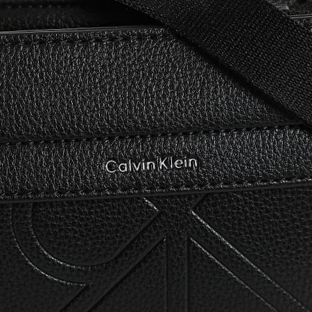 Calvin Klein - Sacoche Emblem Emboss Slim Flatpack D3370G Noir