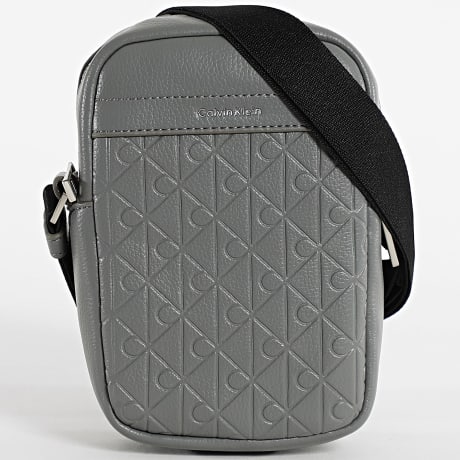 Calvin Klein - Bolsa Emblem AOP Embossed Reporter D3228 Cinza Antracite