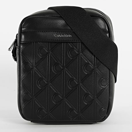 Calvin Klein - Bolsa Emblem AOP Debossed Reporter D3562 Negro